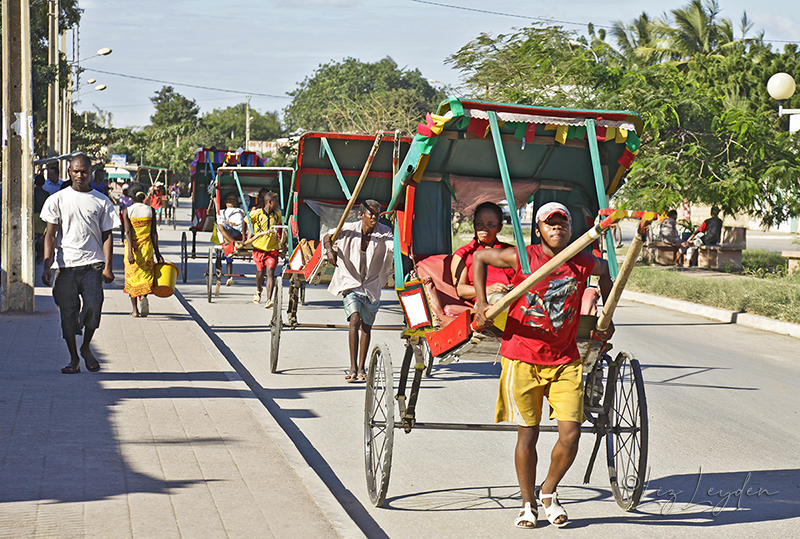 Pousse-pousses being pulled in central Toliara, Madagascar